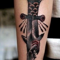 Colored forearm tattoo of shark shaped knife