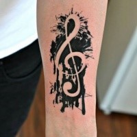 Colored forearm tattoo of small music symbol