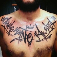 Colored graffiti style chest tattoo of big lettering