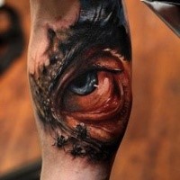 Colored horror style arm tattoo of creepy eye