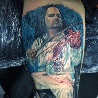 Colored horror style biceps tattoo of man with bloody hand and saw
