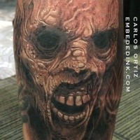 Colored horror style big leg tattoo of creepy monster face