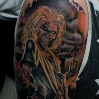 Colored horror style colored shoulder tattoo of creepy monster
