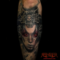 Colored horror style creepy looking arm tattoo of devils woman