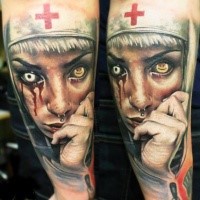 Colored horror style creepy looking arm tattoo of bloody monster nurse