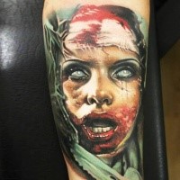 Colored horror style creepy looking biceps tattoo of bloody woman