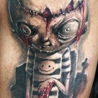 Colored horror style creepy looking bloody doll tattoo on shoulder