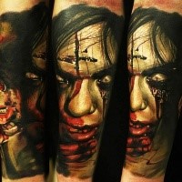 Colored horror style creepy looking bloody monster woman tattoo
