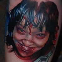 Colored horror style creepy looking girl tattoo