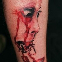 Colored horror style creepy looking leg tattoo of bloody geisha face