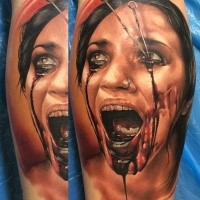 Colored horror style creepy looking leg tattoo of bloody woman