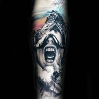 Colored horror style creepy looking man in mask tattoo on forearm