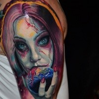 Colored horror style creepy looking shoulder tattoo of vampire woman