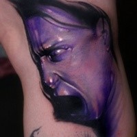 Colored horror style creepy looking woman face tattoo