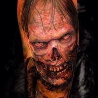 Colored horror style creepy looking zombie tattoo on arm