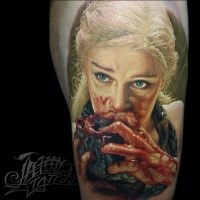 Colored horror style detailed bloody shoulder tattoo of woman eating heart