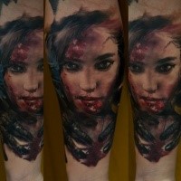 Colored horror style detailed forearm tattoo of bloody woman face