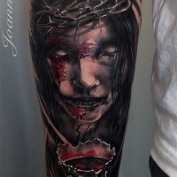 Colored horror style forearm tattoo of woman with blood and vine