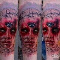 Colored horror style medium size forearm tattoo fo bloody woman with three eyes