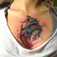 Colored illustrative style chest tattoo of human heart