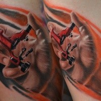 Colored illustrative style tattoo of hand holding mechanism