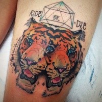 Colored illustrative style thigh tattoo of tiger heads with ornaments and lettering
