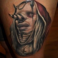 Colored illustrative style thigh tattoo of demonic clown demon