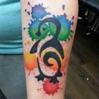 Colored ink stylized penguin tattoo