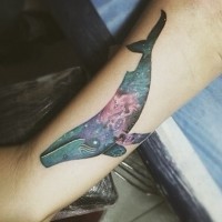 Colored medium size whale tattoo on arm in futuristic style