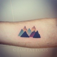 Colored mountain scenery designed tattoo on forearm