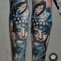 Colored new school style arm tattoo of magical woman with octopus