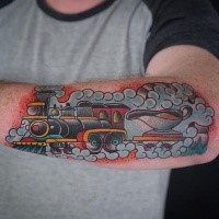 Colored old school style arm tattoo of steam train with cup