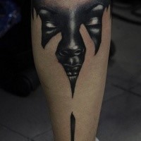 Colored original looking leg tattoo of black woman face