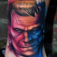 Colored portrait style leg tattoo of Frankenstein monster