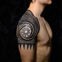Colored shoulder tattoo of various Celtic ornaments