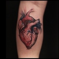 Colored simple looking vintage style forearm tattoo of human heart