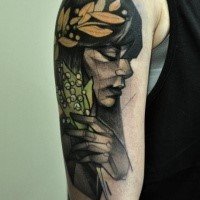 Colored sketch style shoulder tattoo of woman with leaves