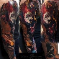 Colored sleeve tattoo of creepy devil with book