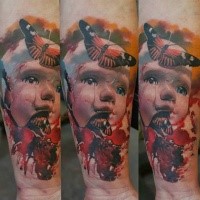 Colored surrealism style colored forearm tattoo of doll with butterflies