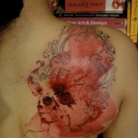 Colored surrealism style scapular tattoo of human skull