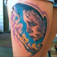 Colored thigh tattoo of detailed Edward Scissors hands