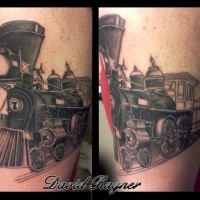 Colored upper arm tattoo of vintage train
