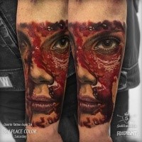 Colored very detailed arm tattoo of bloody woman face