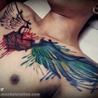 Colored whole chest tattoo of human hear with wings