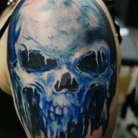 Colorful amazing looking shoulder tattoo of demonic skull