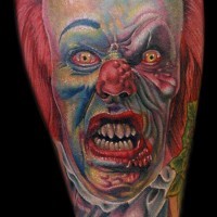 Colorful angry clown tattoo on arm