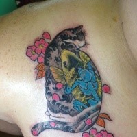 Colorful Asian traditional style collarbone tattoo on Manmon cat with flowers