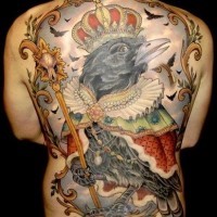 Colorful big crow in royal mantle and crown tattoo on back