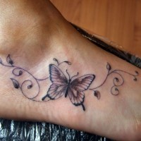 Colorful butterfly cute foot tattoo with curls