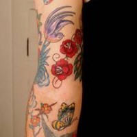Colorful cool oldschool tattoo on whole arm